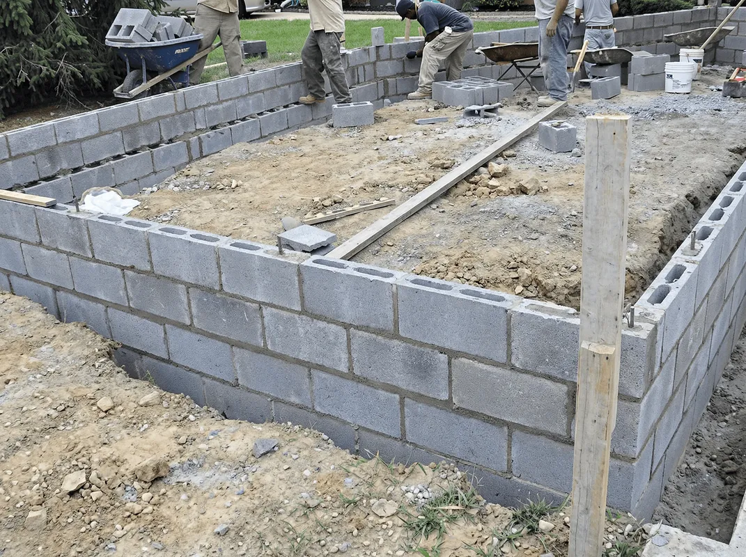 Professionals building a foundation with blocks in Louisville, KY