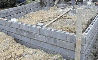Professionals building a foundation with blocks in Louisville, KY