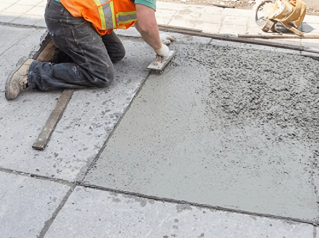 Professional repairing a concrete floor in Louisville, KY